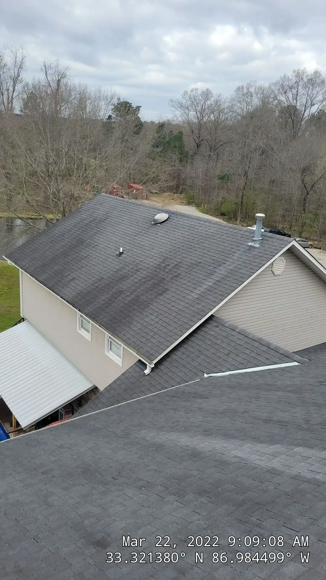 A white house with a black roof.